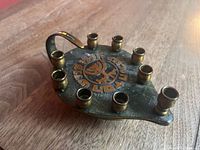 Top view showing menorah shape, candle holders, inscription