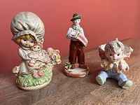 Front view of all three figurines together