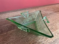 Overall view of triangular green glass candy dish showing handles and etched pattern