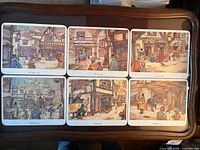 Front view of all six illustrated placemats