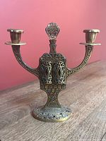 Front view of two-arm candlestick with doors closed