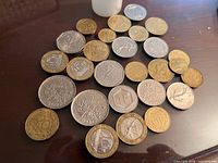 Spread of mixed international coins on tabletop