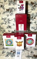 Group shot of five boxed Hallmark ornaments