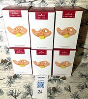 Front view of six Hallmark Keepsake Our Babymoon ornament boxes