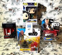 Group shot of all four sealed Star Wars and Funko items
