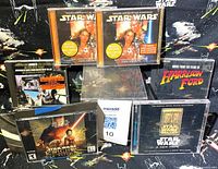 Front view of all five CDs and PC game case arranged together