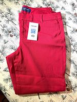 Pair of folded red Old Navy Pixie pants with lot sticker