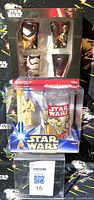 Front view showing boxed shot glass set above boxed Obi-Wan cup