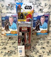 Front view of all four packaged Star Wars items