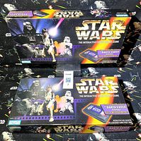 Front lids of both Star Wars Interactive Video Board Game boxes showing cover art and branding