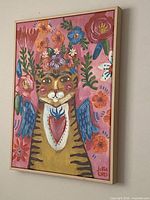 Full angled view of framed cat painting