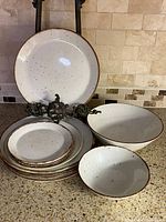 Front view of stacked plates and bowls showing overall set