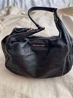 Full view of Michael Kors black leather shoulder bag