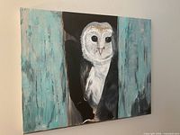Front view of the barn owl painting hung on wall