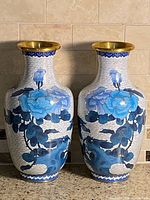 Front view of the two cloisonné vases showing blue peony design and brass mouths