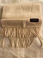 Scarf folded showing fringe and Sonia Rykiel label