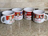 All four Campbell's soup mugs lined in a row