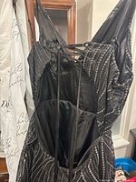 Back view showing lace-up open back and fabric pattern