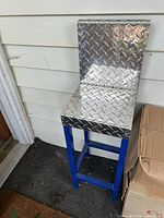 Full view of child-size bar stool showing diamond plate seat/back and blue frame