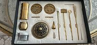 Complete Kodo incense kit in fitted tray showing all brass tools, seals, cover, containers, and mold