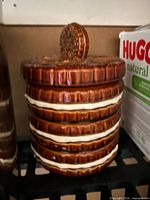 Cookie jar front view showing stack design and lid