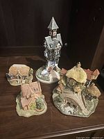 Front view of all four cottage figurines