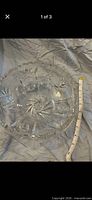 Top view of clear cut crystal bowl showing starburst pattern and tape measure