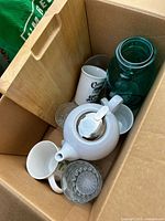 Box containing teapot, mugs, tumblers, mason jar and cutting board