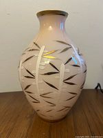 Overall view of pink glass vase showing bamboo design and shape