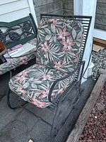 Full view of metal rocking chair with cushions