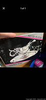 Retail box showing silver plated gravy boat image and labeling