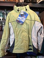 Front view of rain jacket with hang tag