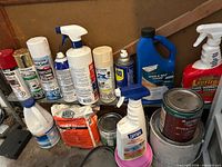 Front view showing all aerosols, cleaners, paint cans and patch compound