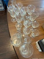 Overhead view showing all pale yellow glasses grouped by size