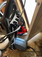 Blue electric pressure washer with black handle and cords