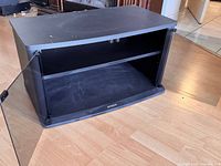 Interior view with one door open, showing shelf and cable openings