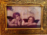 Front view of the gilt framed cherub print