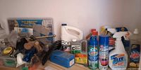 Wide view showing cleaning bottles, aerosols, hand tools and hardware