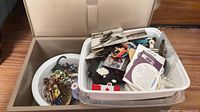 Overall lot showing storage box with two trays of mixed small items