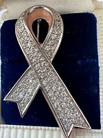 Front view showing pavé stones and pink enamel