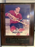 Full view of signed photo mounted on wood plaque