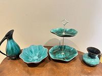 All four Blue Mountain Pottery pieces arranged on table