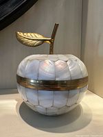 Apple-shaped brass and mother of pearl trinket box closed view