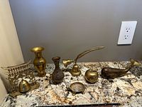 All seven brass items displayed together