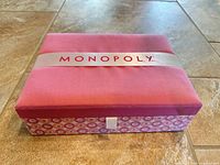 Closed fabric-covered Monopoly Boutique Edition box