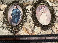 Front view of both framed prints with ruler for scale