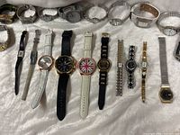 Full layout of assorted wristwatches showing variety of styles and straps