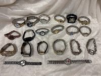 Group shot of all twenty watches laid out on fabric