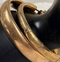 close-up of both bangles showing widths and finishes