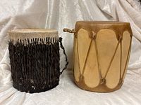 Two tribal drums side by side showing overall form